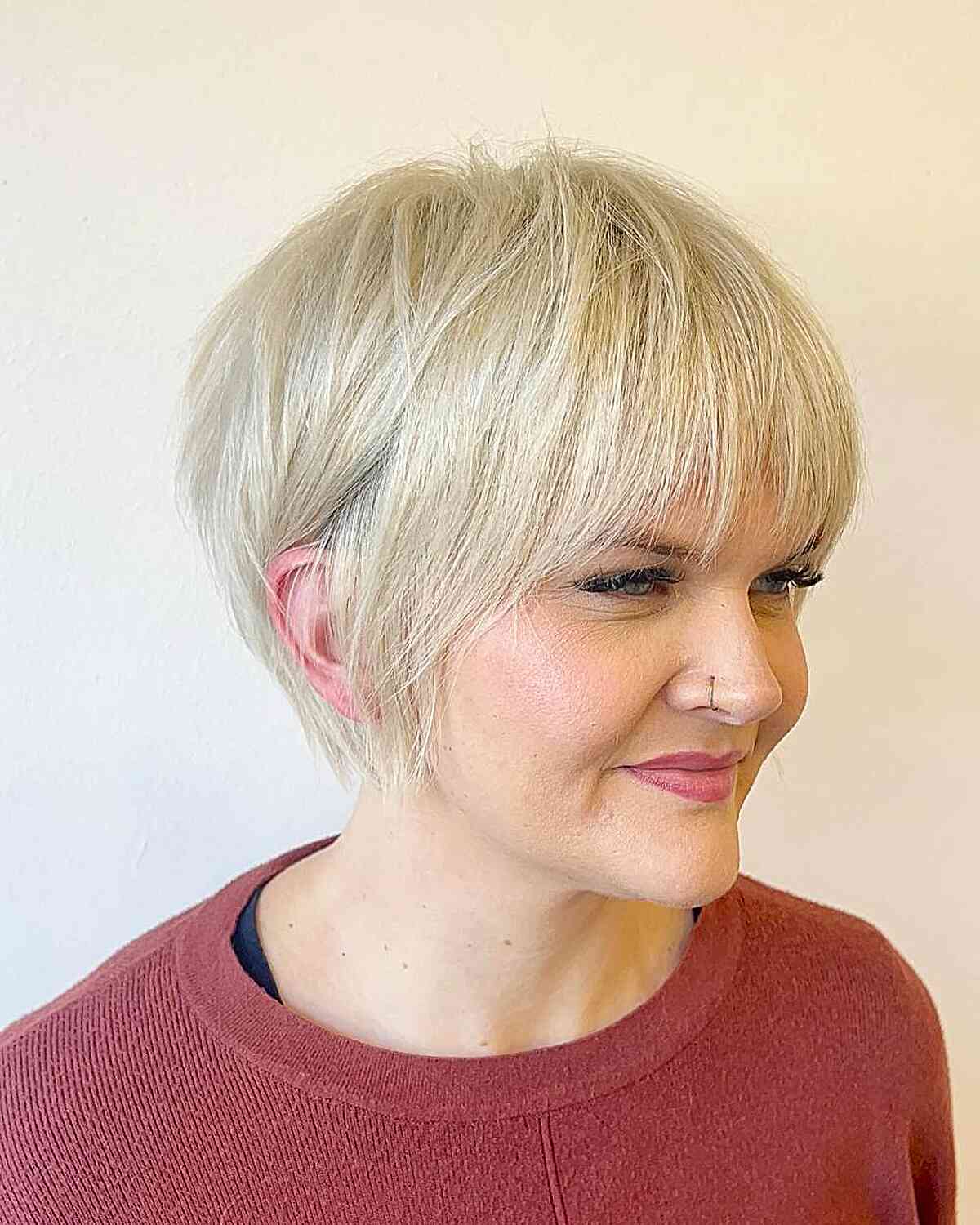 Chic Textured Short Blonde Cut with Bangs