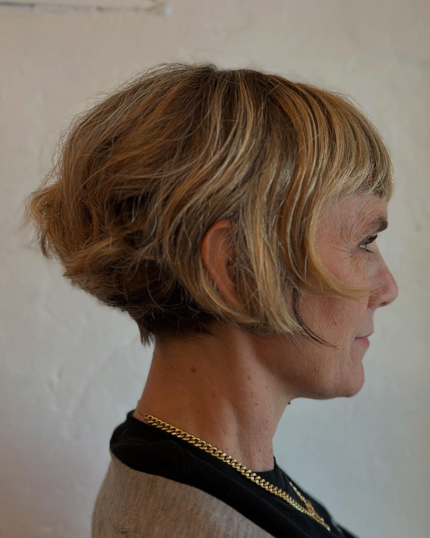 Dynamic Blonde Tousled Micro Bob with Feathered Bangs