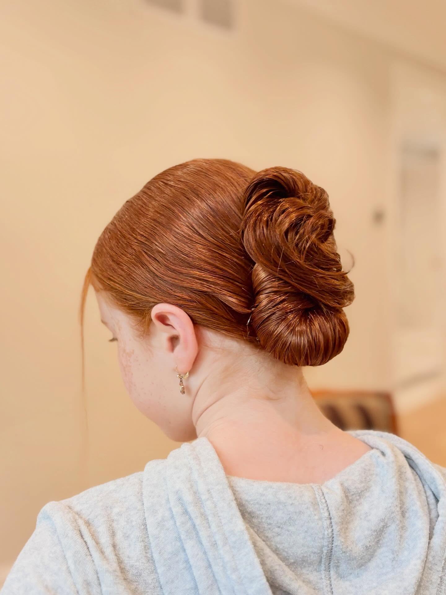 Elegant Auburn Swirled Bun