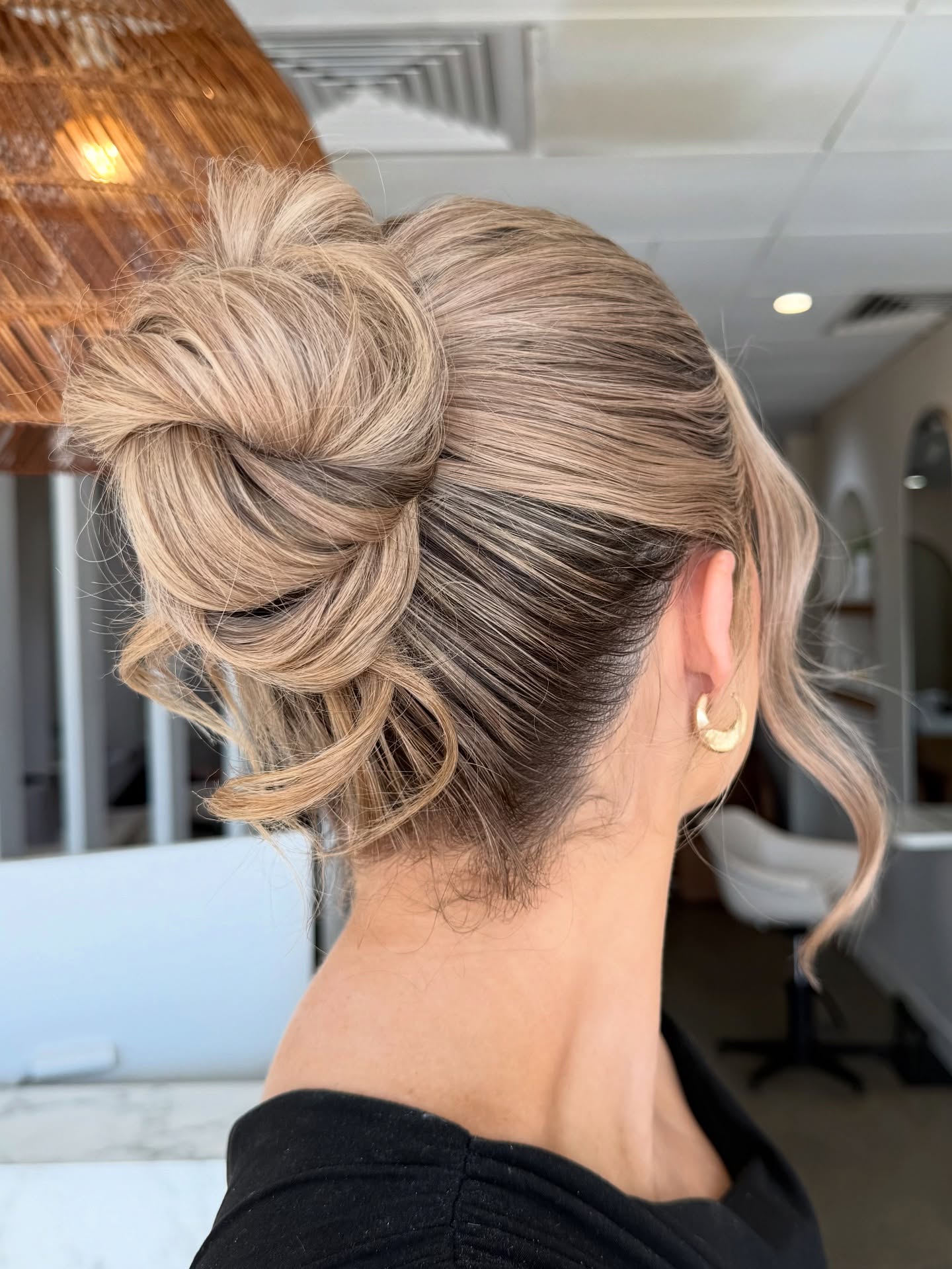 Elegant Twisted Chignon with Soft Tendrils
