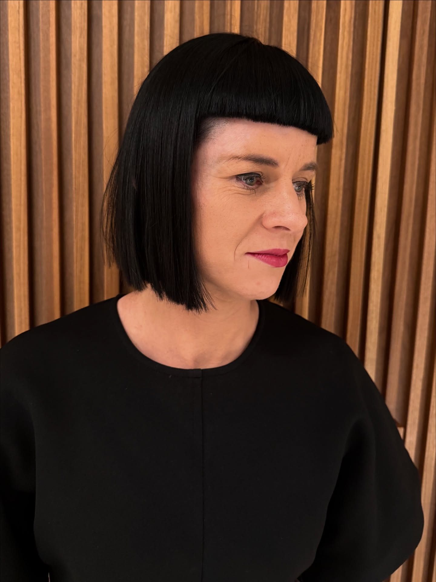 Jet-Black Angular Bob with Precision Bangs