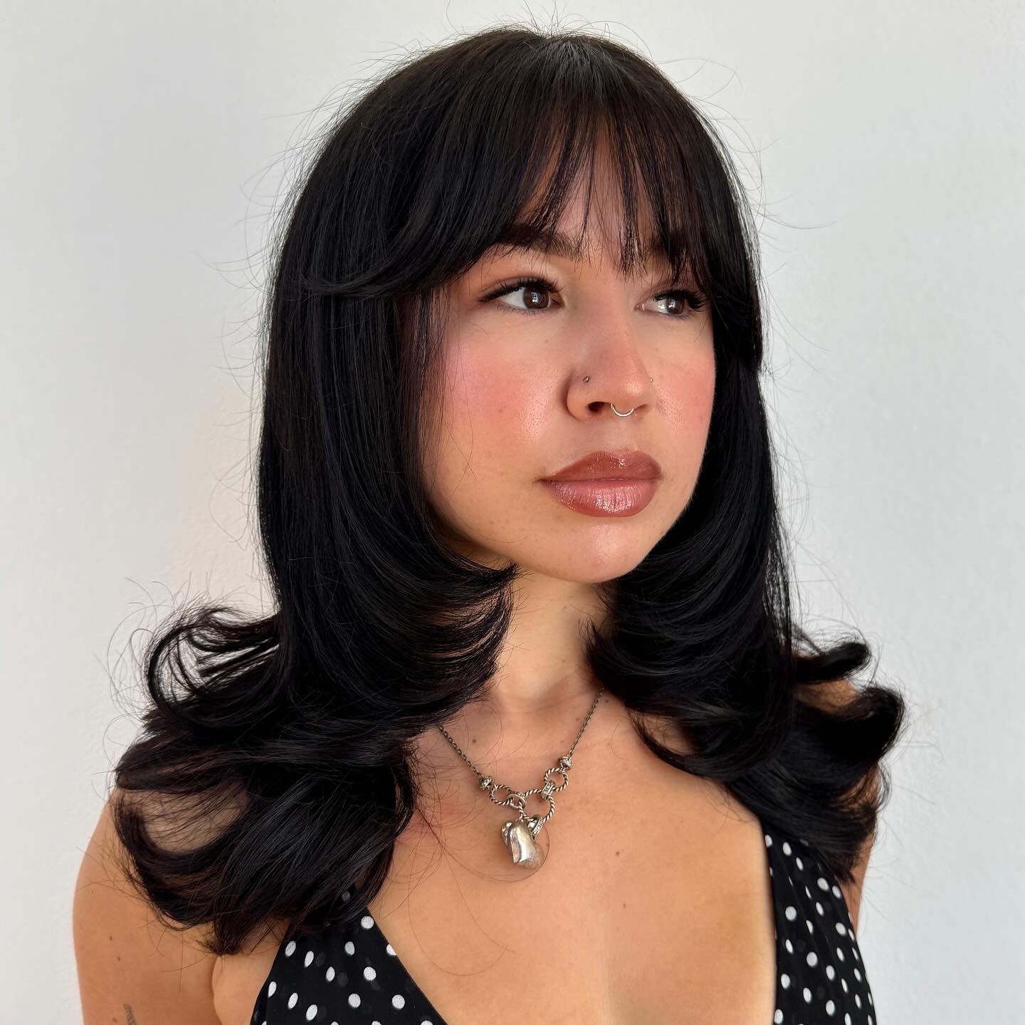 Layered Black Haircut with Wispy Bangs