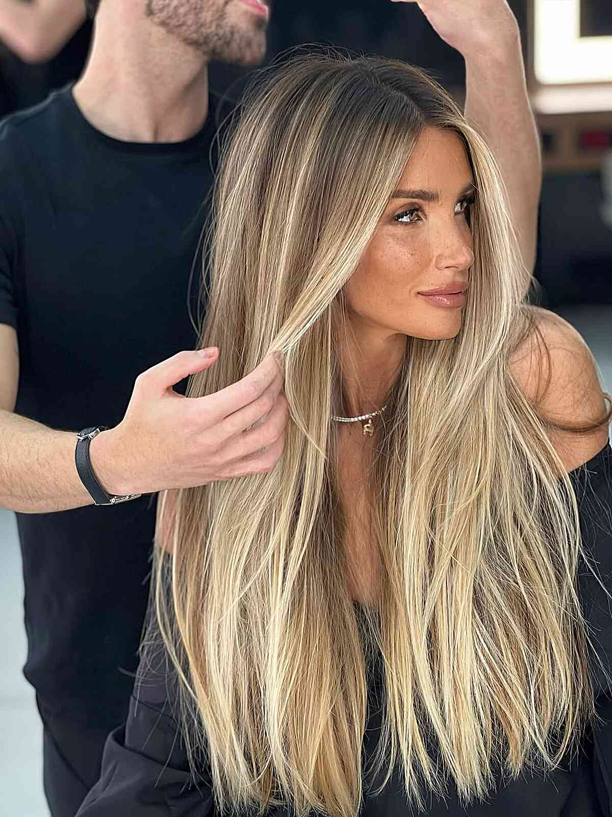 Long Straight Honey Blonde Locks with Subtle Layers