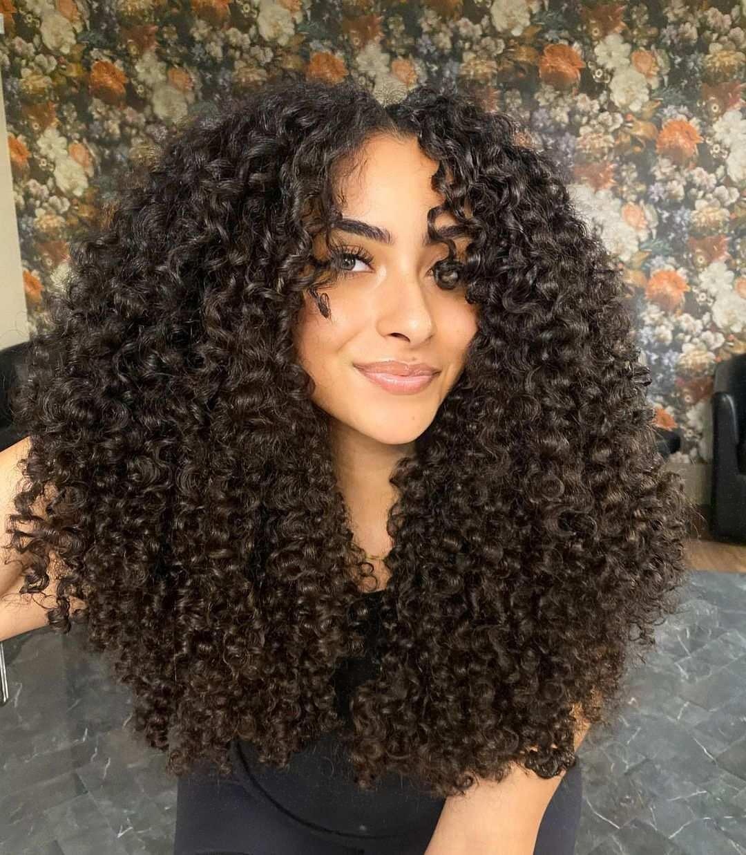 Luxuriant Deep Curly Mane with Face-Framing Layers