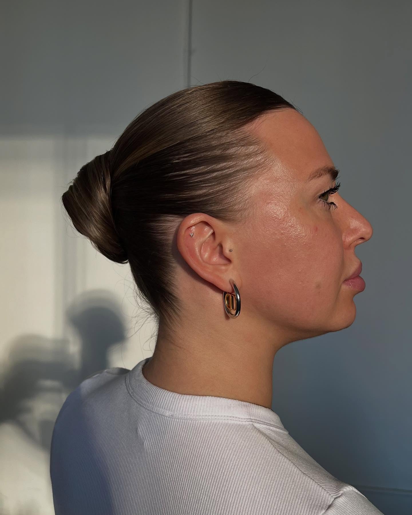 Polished High Bun with Sleek Finish