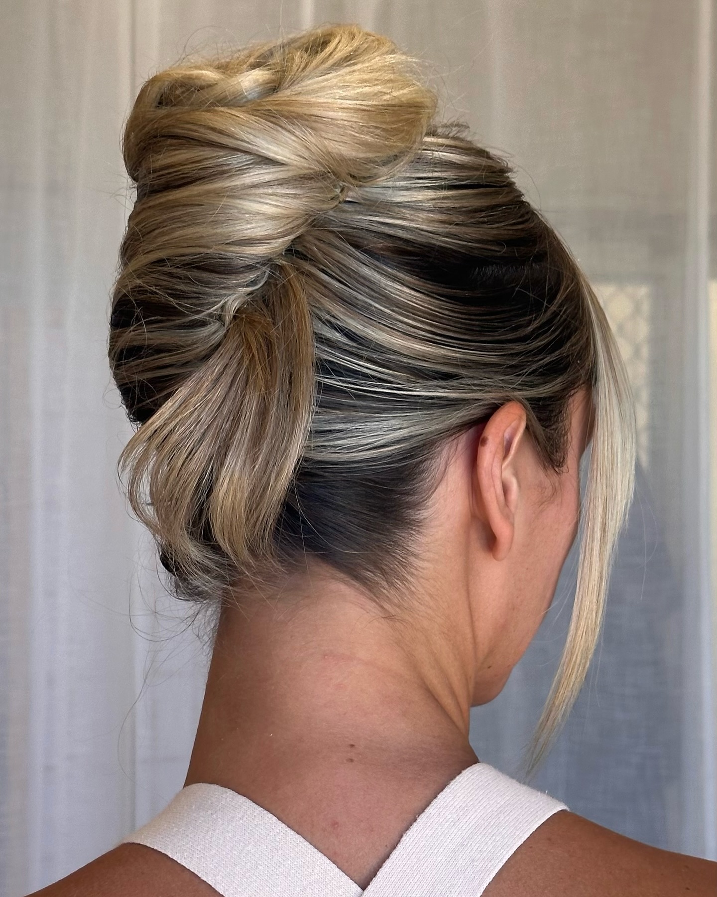 Refined Blonde Textured Bun with Sleek Finish
