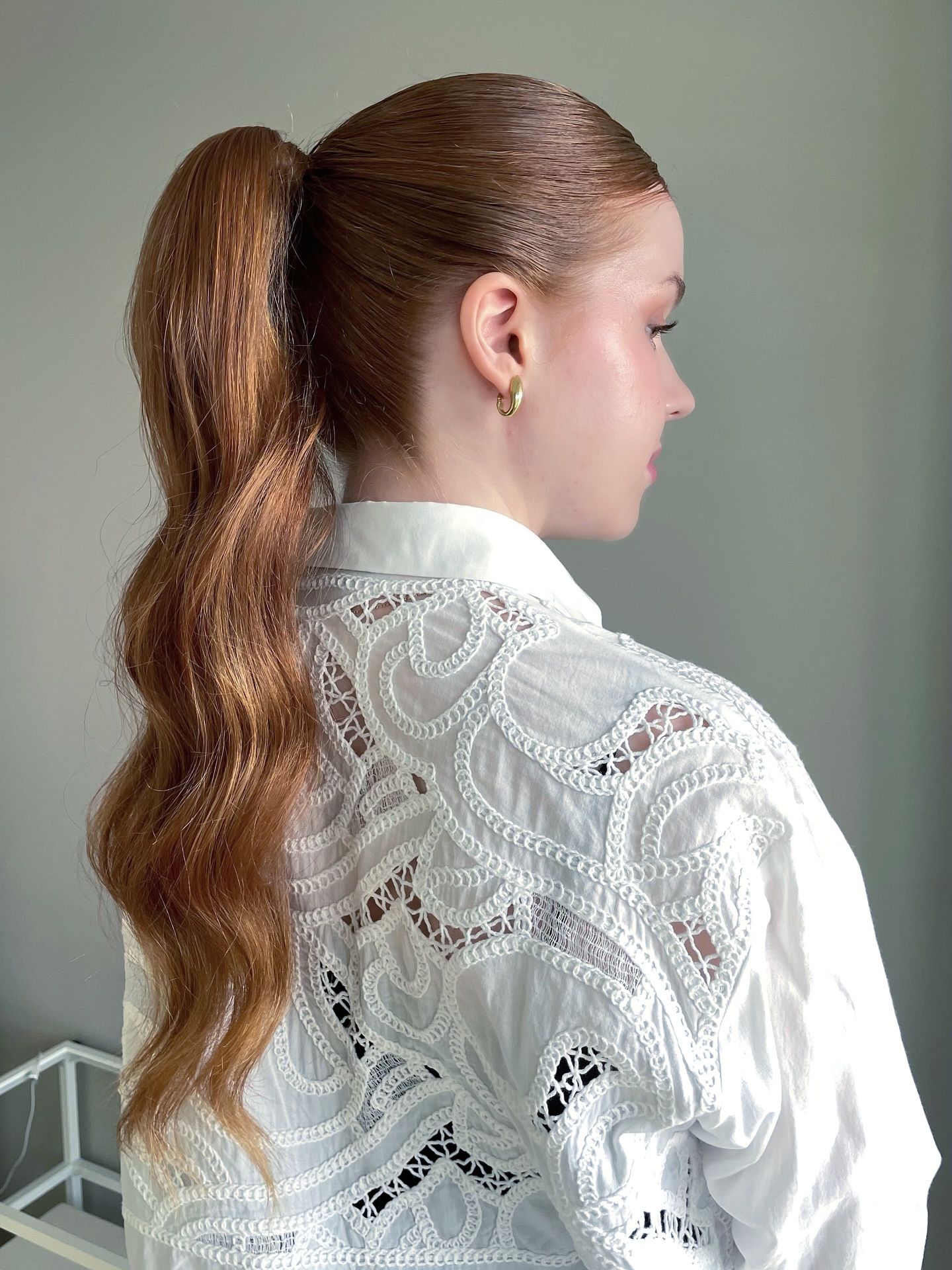 Sleek Auburn Ponytail with Gentle Waves