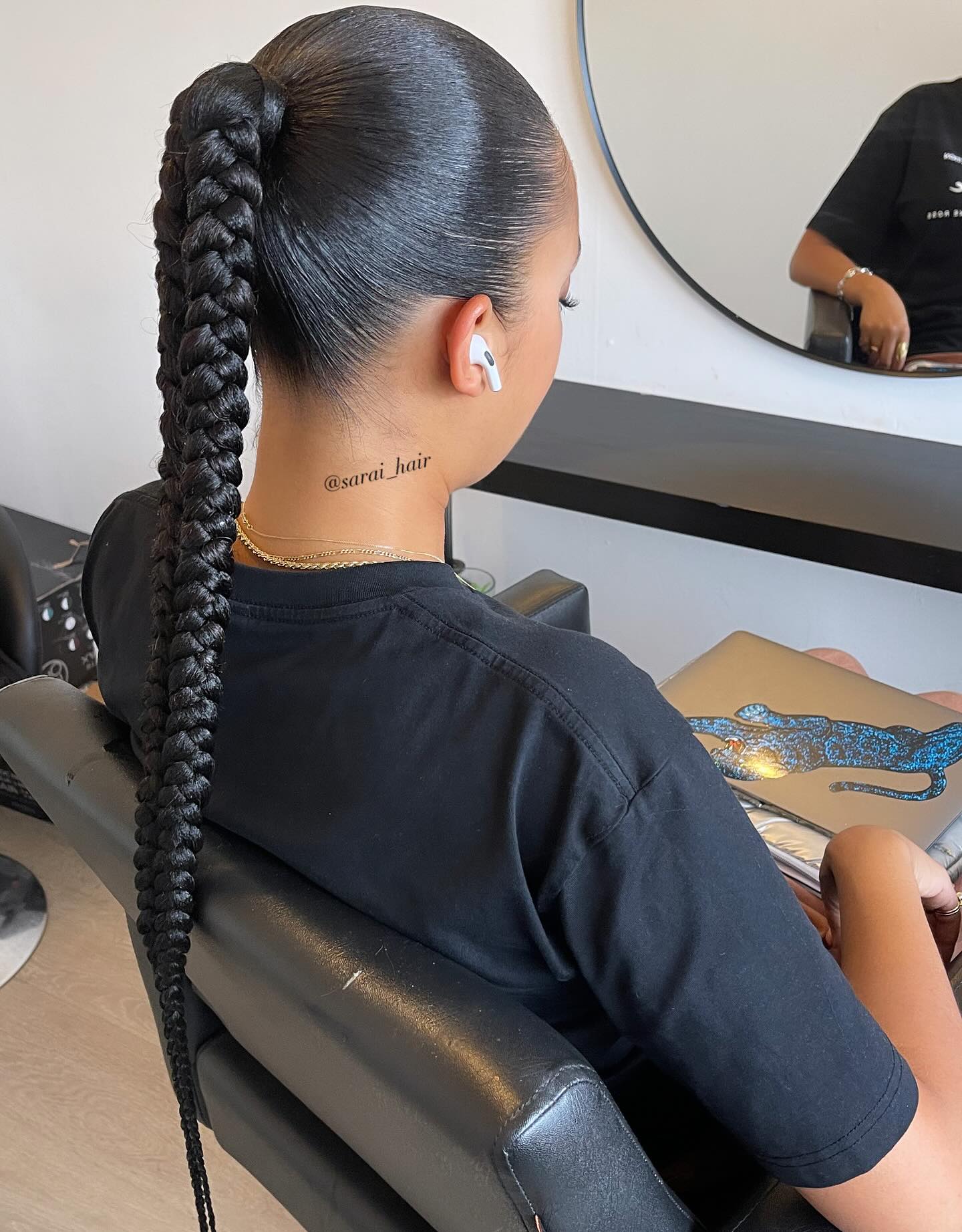 Sleek Long Braided Ponytail with Glossy Finish