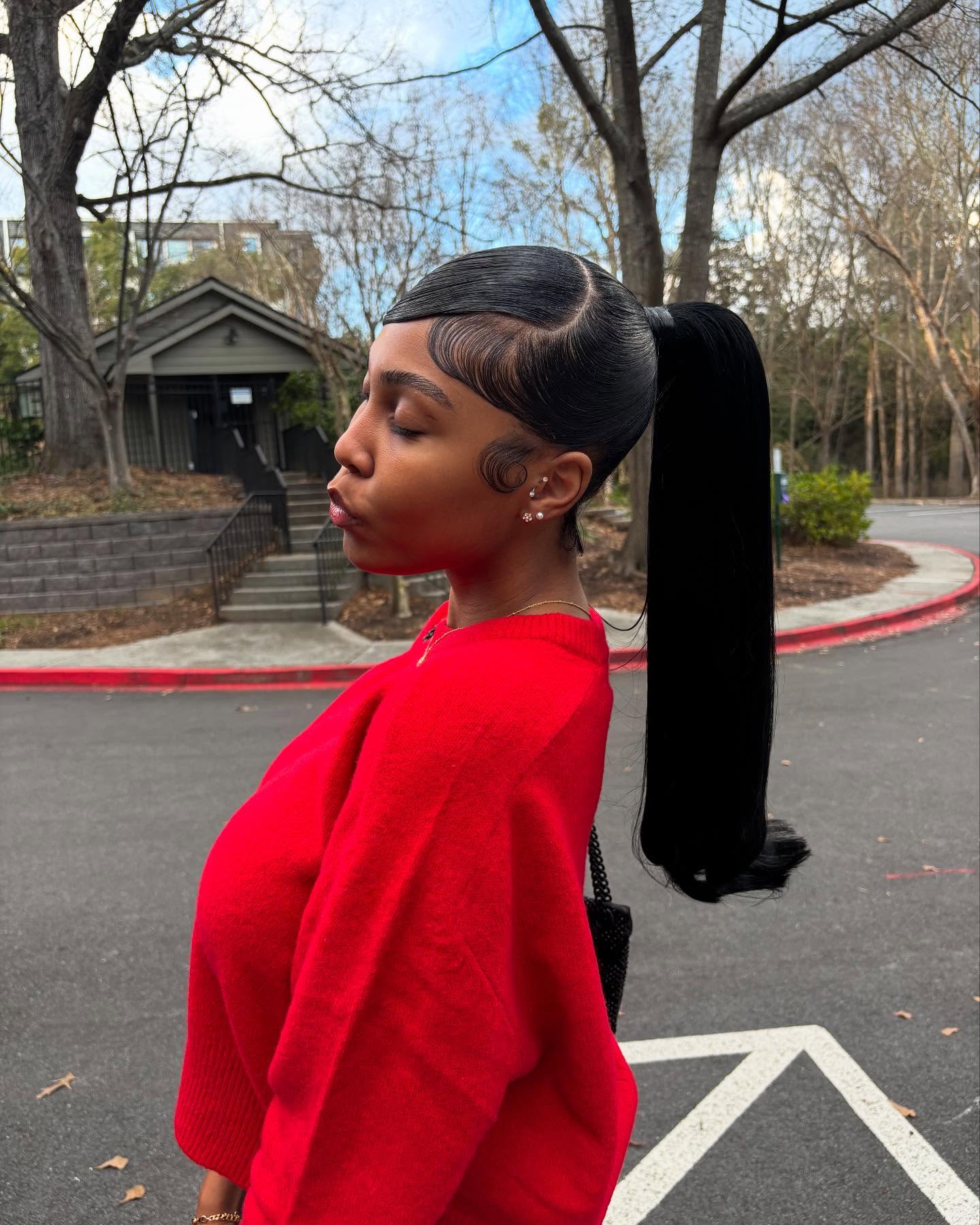 Sleek Side-Swept Ponytail with Sculpted Baby Hairs