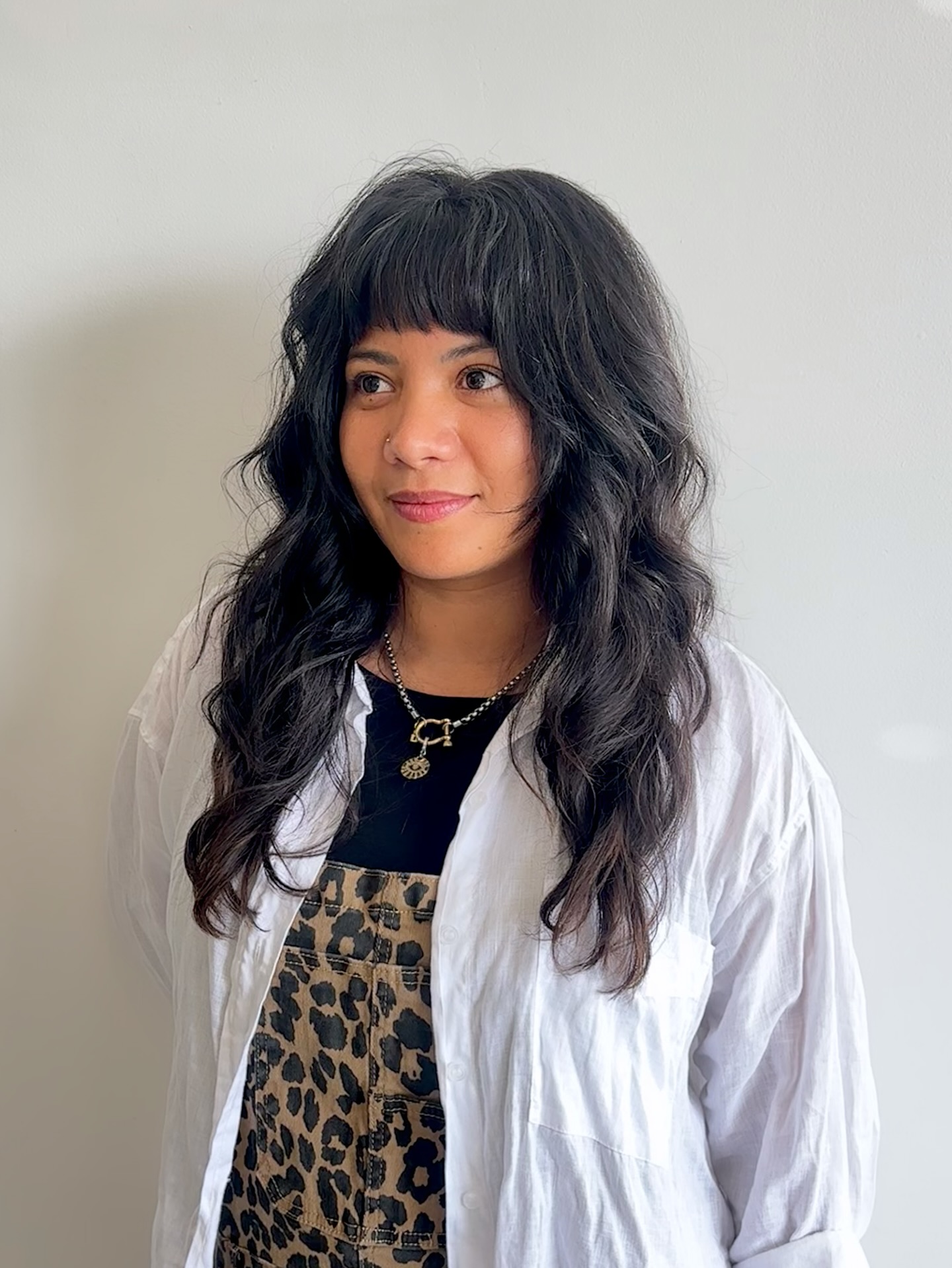 Textured Long Layers with Soft Curtain Bangs