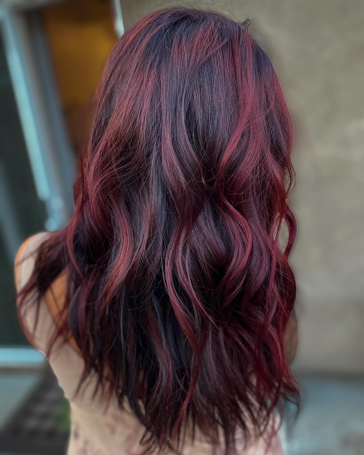 Bold Black and Burgundy Balayage with Luscious Waves