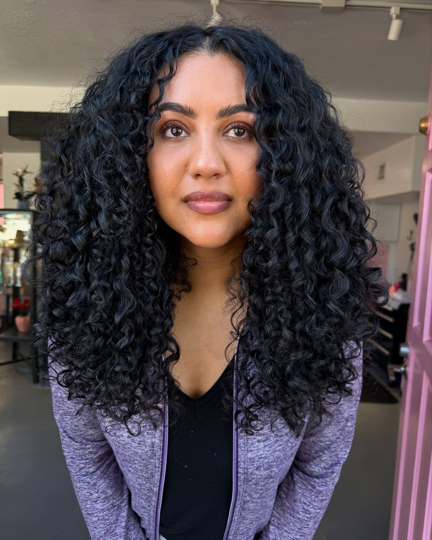 Cascading Ebony Curls with Strategic Layering
