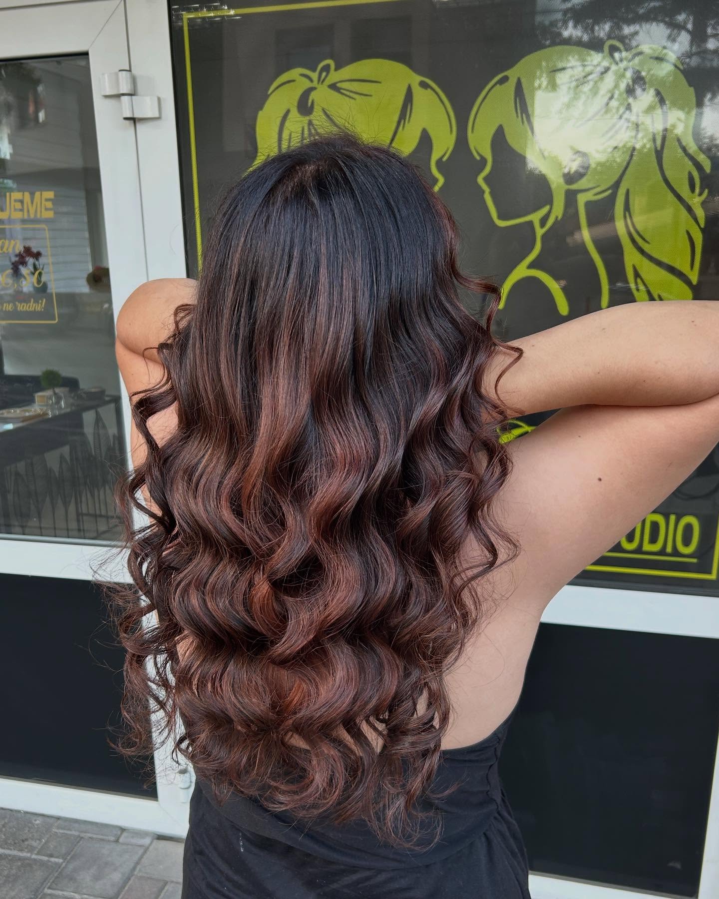 Charming Long Black Waves with Subtle Burgundy Balayage