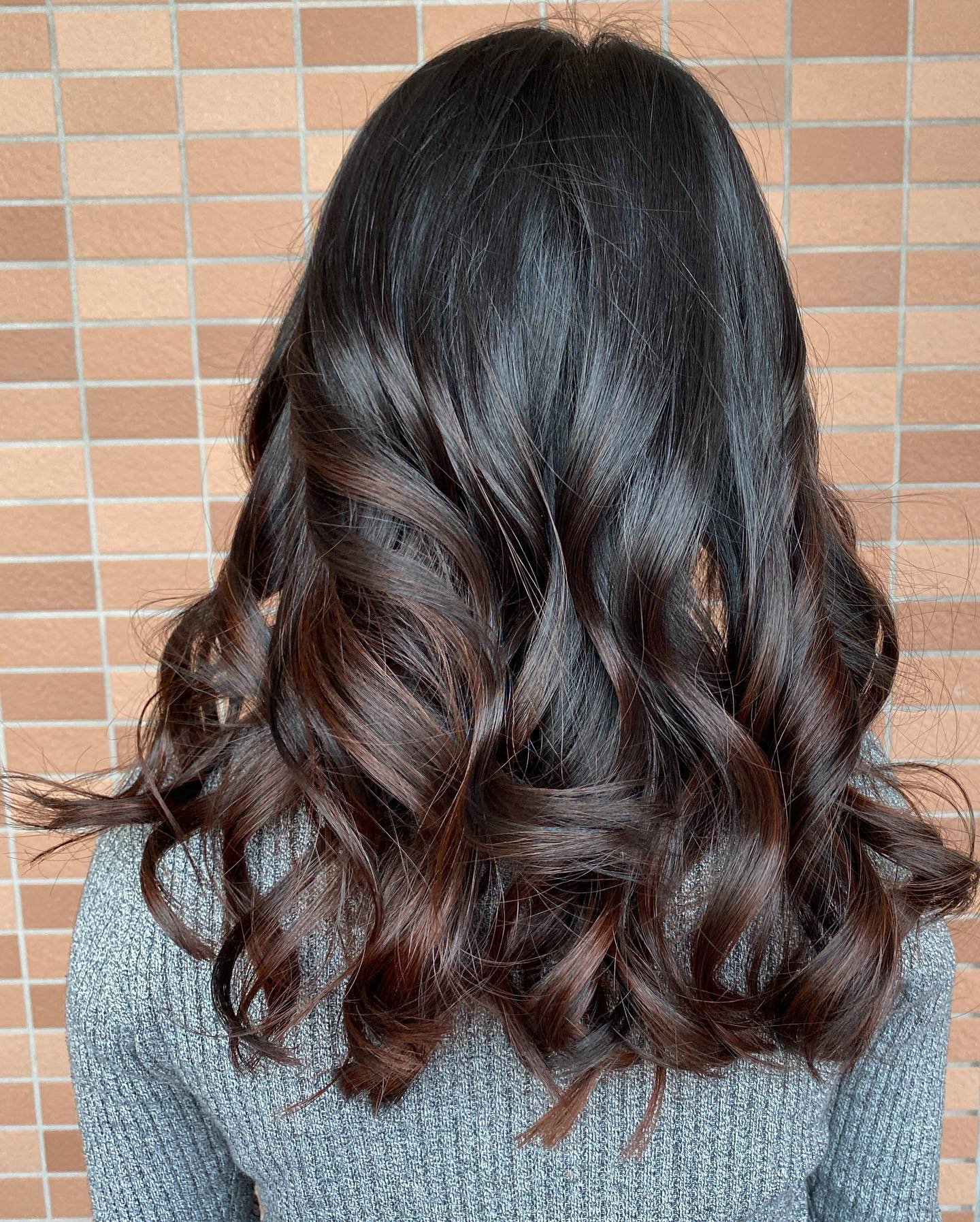 Charming Long Black Waves with Subtle Mahogany Balayage
