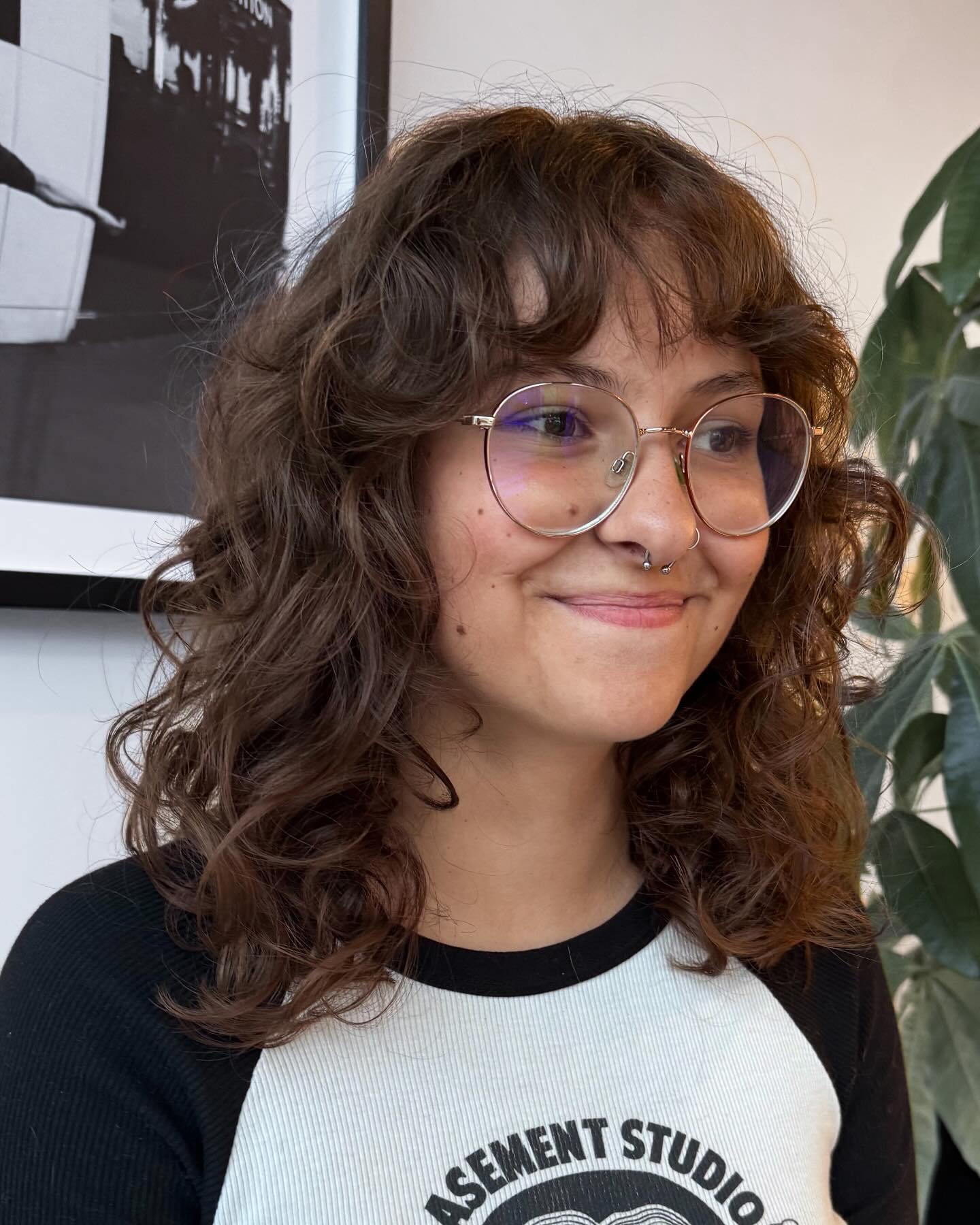 Chic Curly Layers with Soft Curtain Bangs