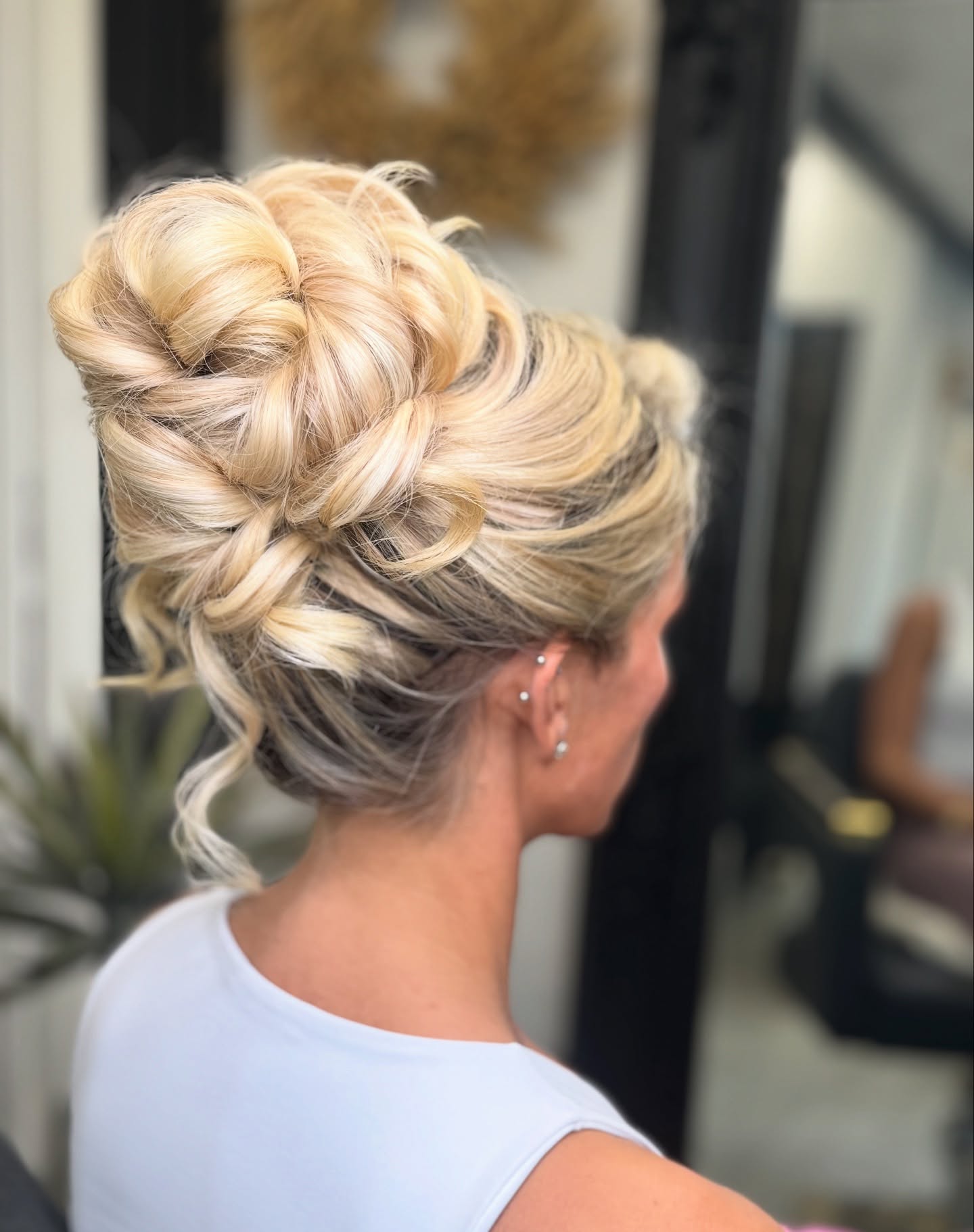 Elegant Twisted Blonde Updo With Subtle Highlights