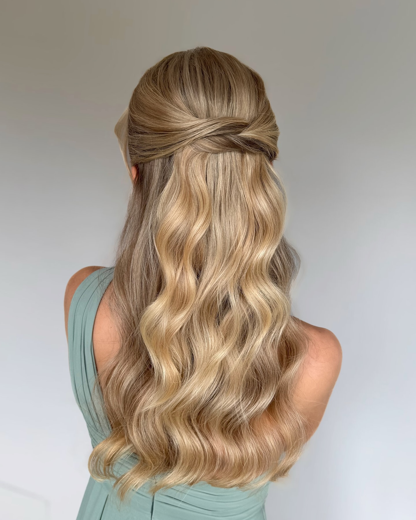 Glamorous Cascading Curls with Twisted Half-Updo