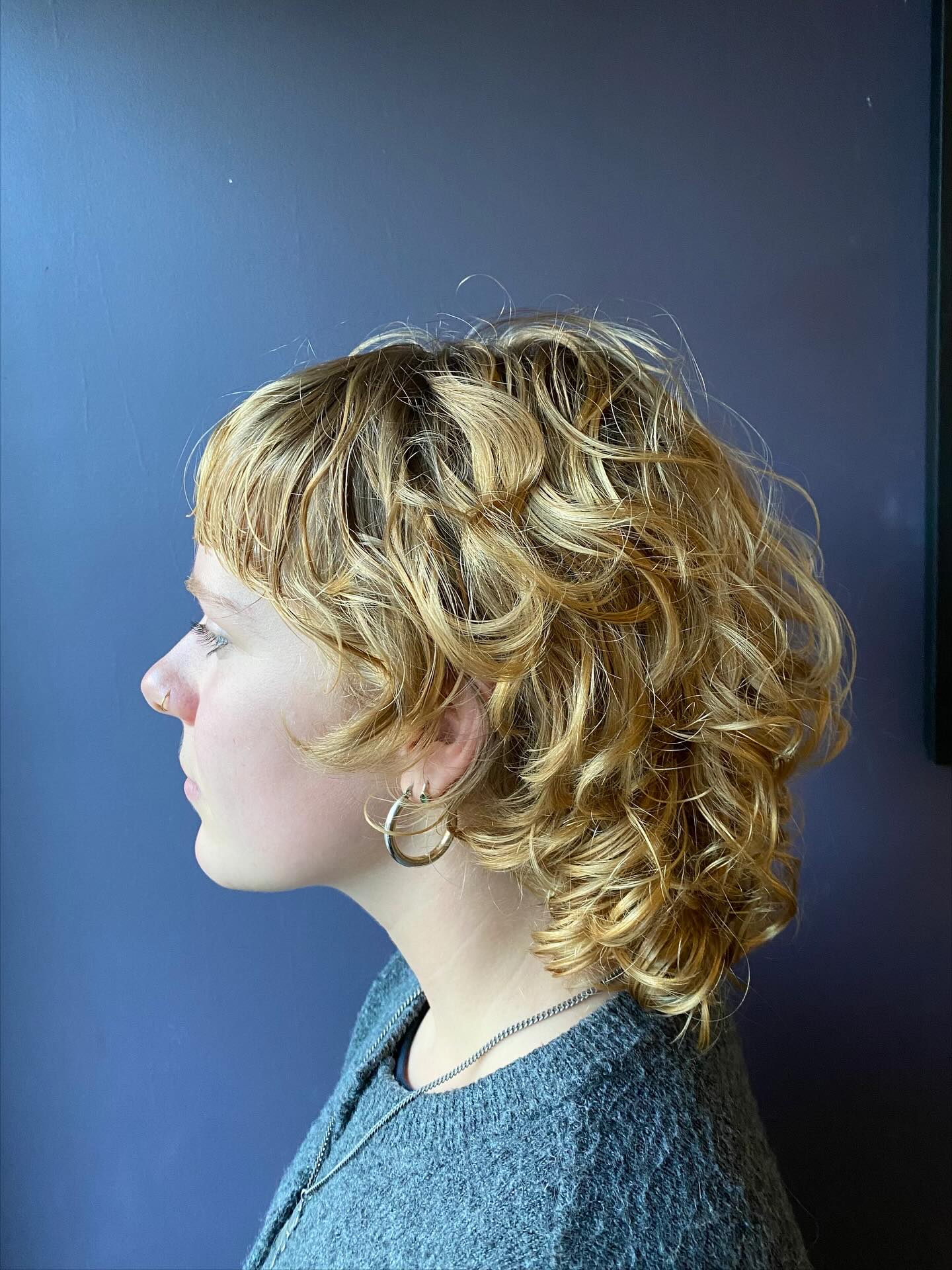 Golden Curls with Tapered Nape Style