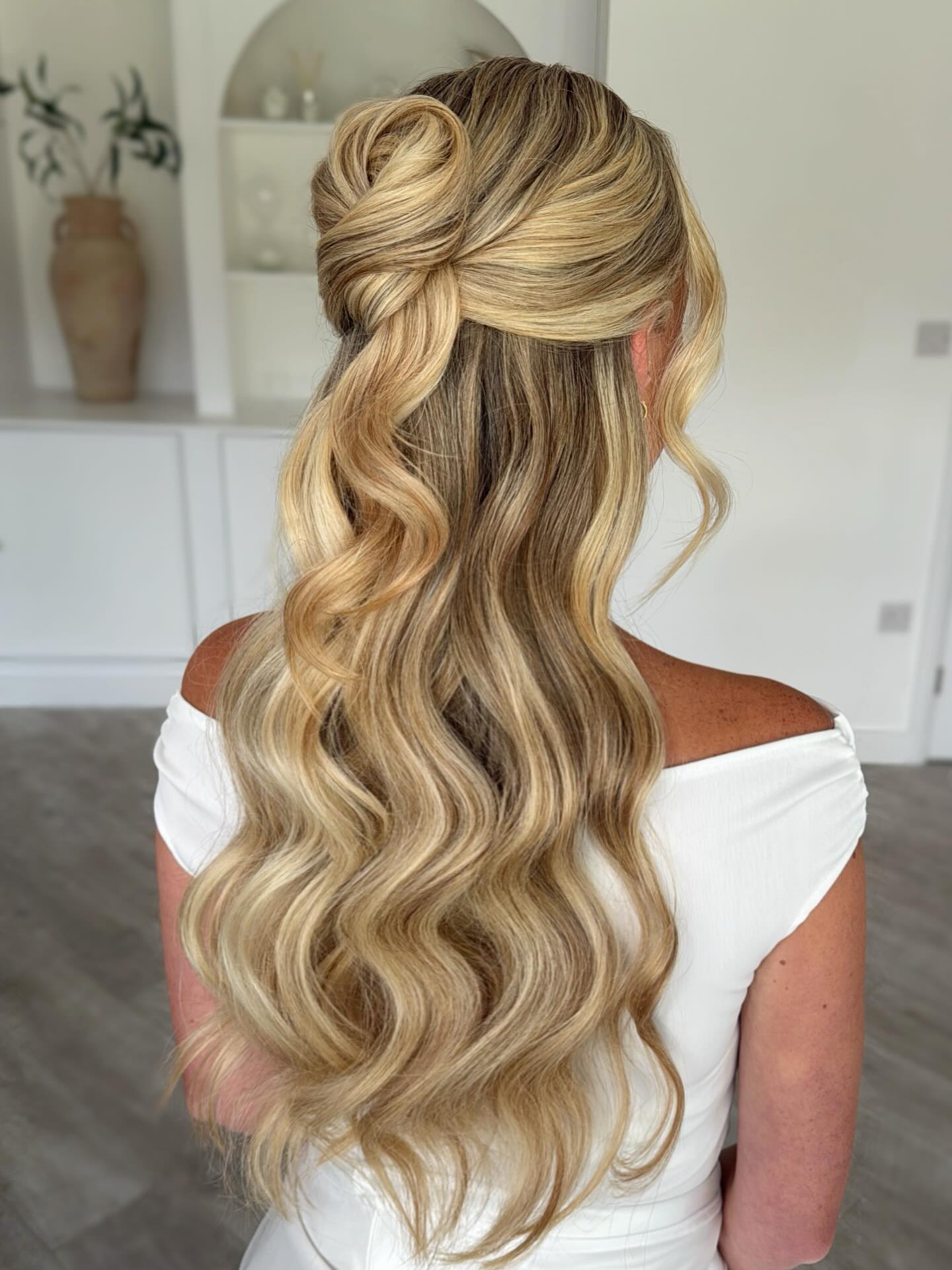 Graceful Blonde Half-Up Heart Twist with Cascading Waves
