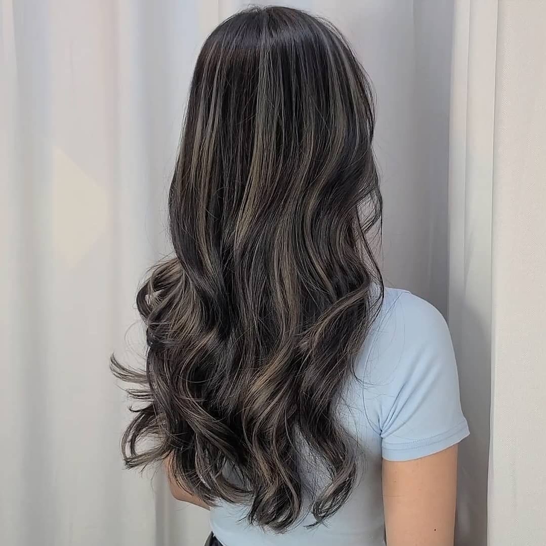 Long Wavy Black Hair with Subtle Balayage