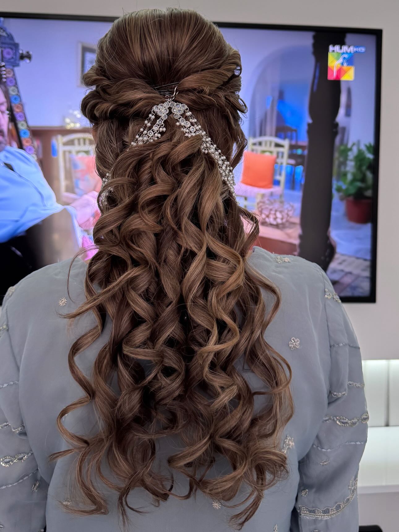 Luxurious Twirls with Sparkling Silver Accents Half-Up Hairstyle