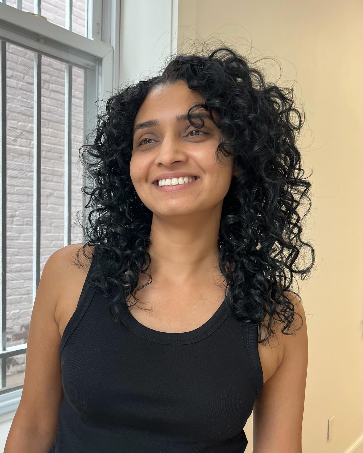 Natural Jet-Black Volumetric Curls with Soft Layering