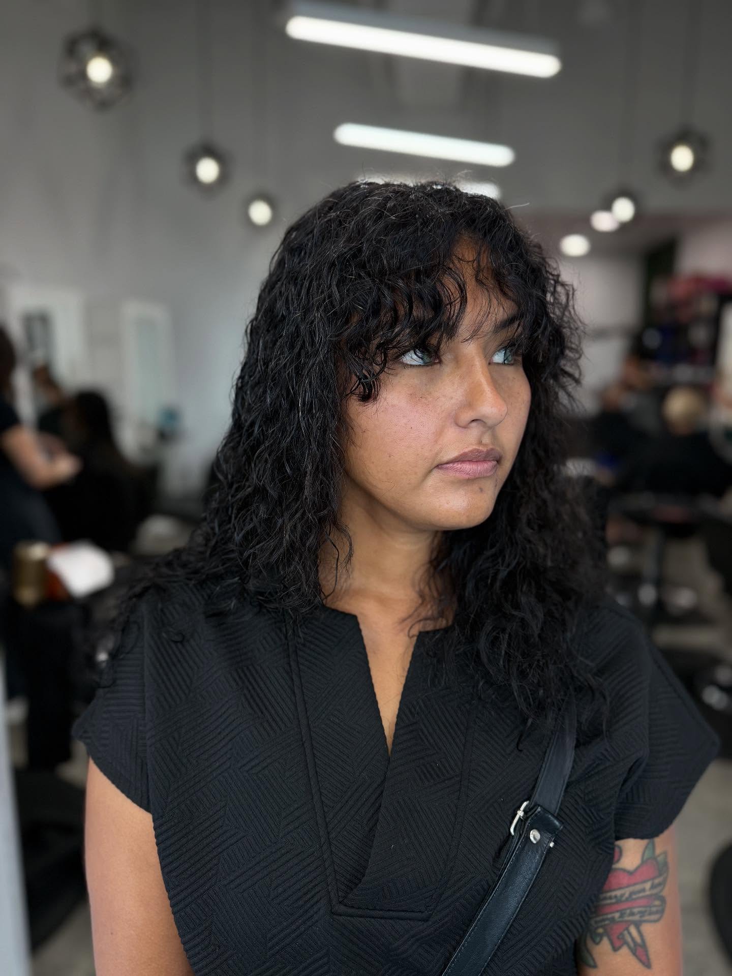 Naturally Textured Shoulder-Length Curls with Subtle Layers