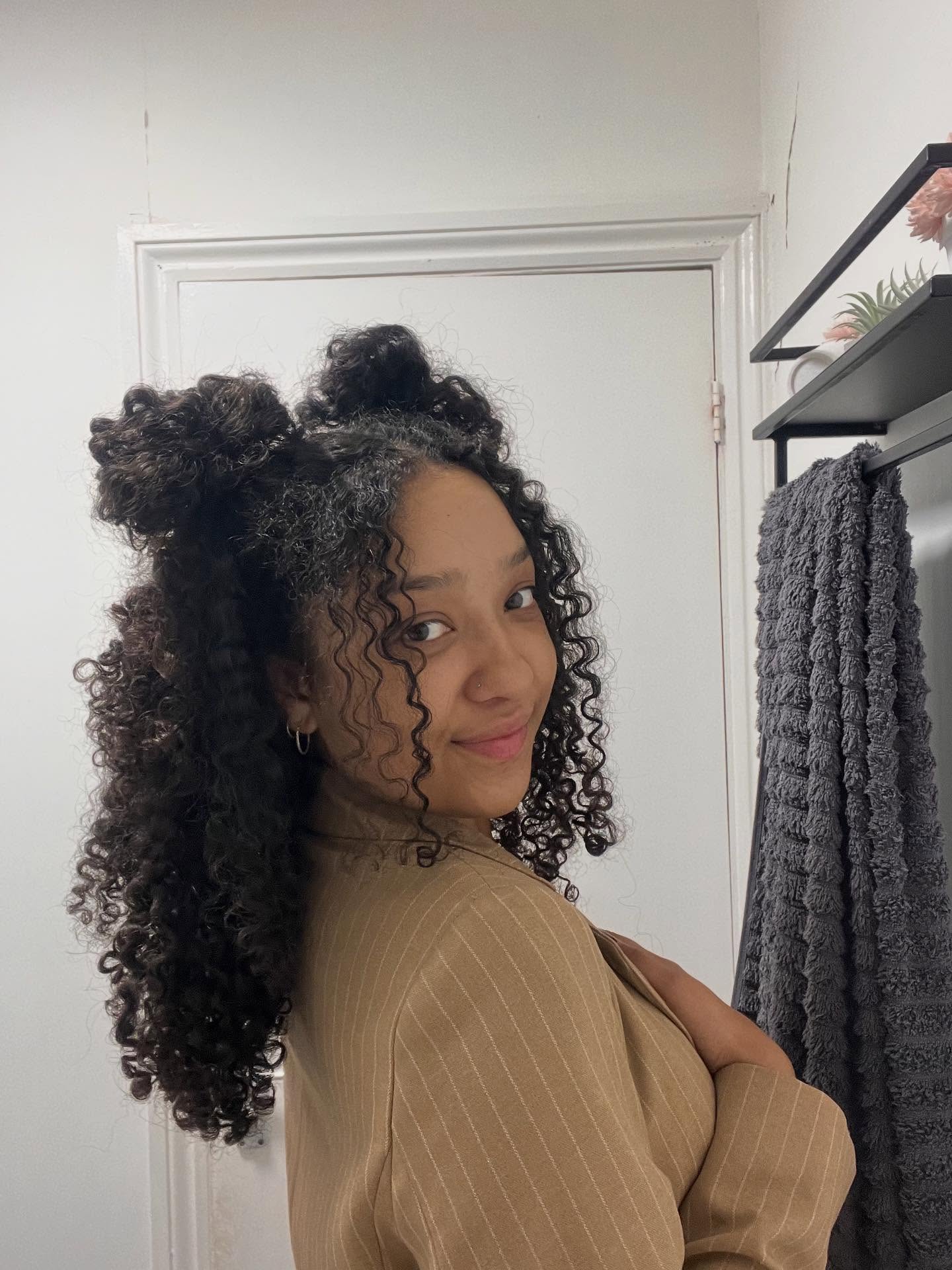 Playful Curly High Buns with Flowing Locks