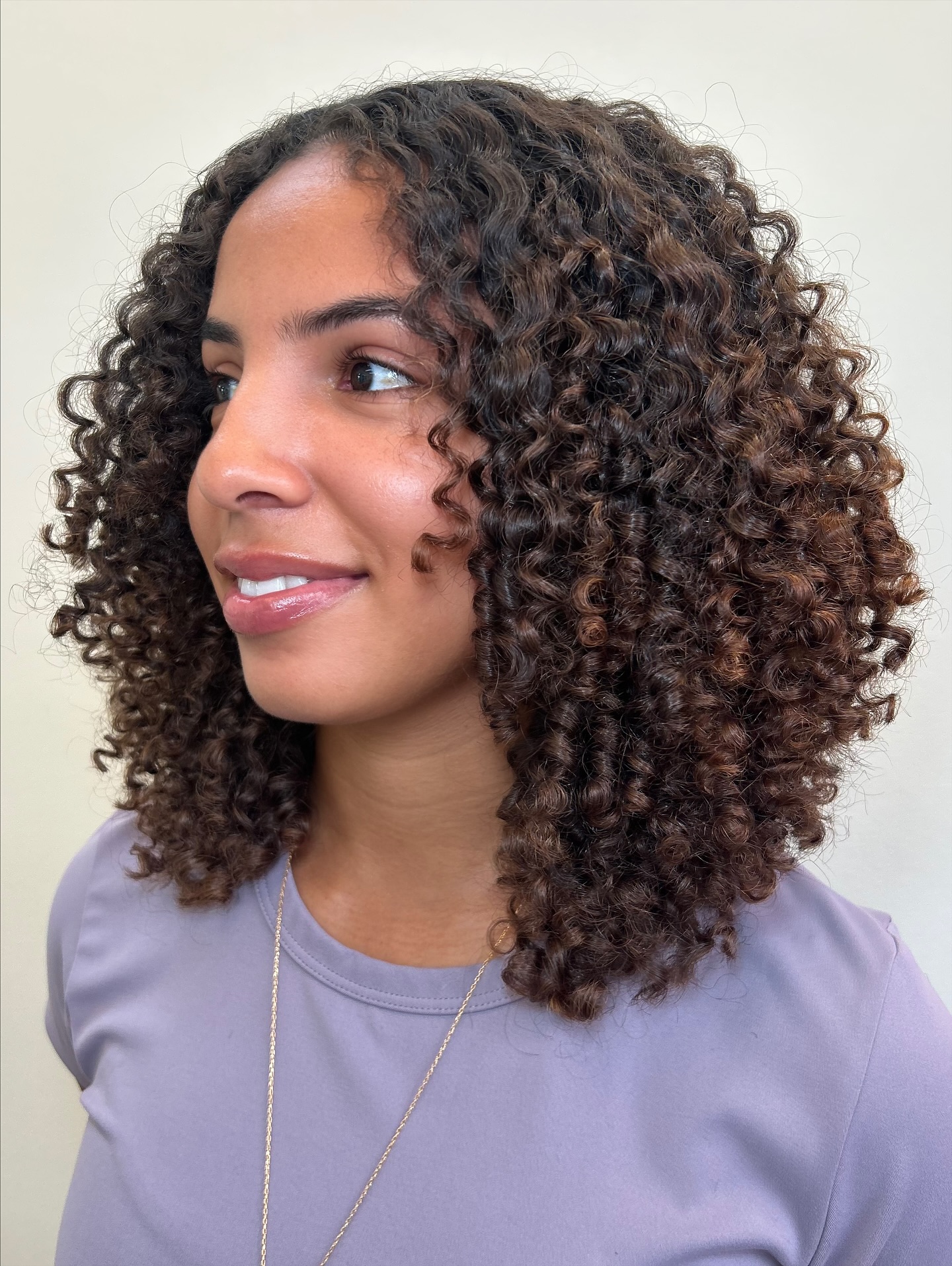 Shoulder-Length Layered Curls with Natural Gradient