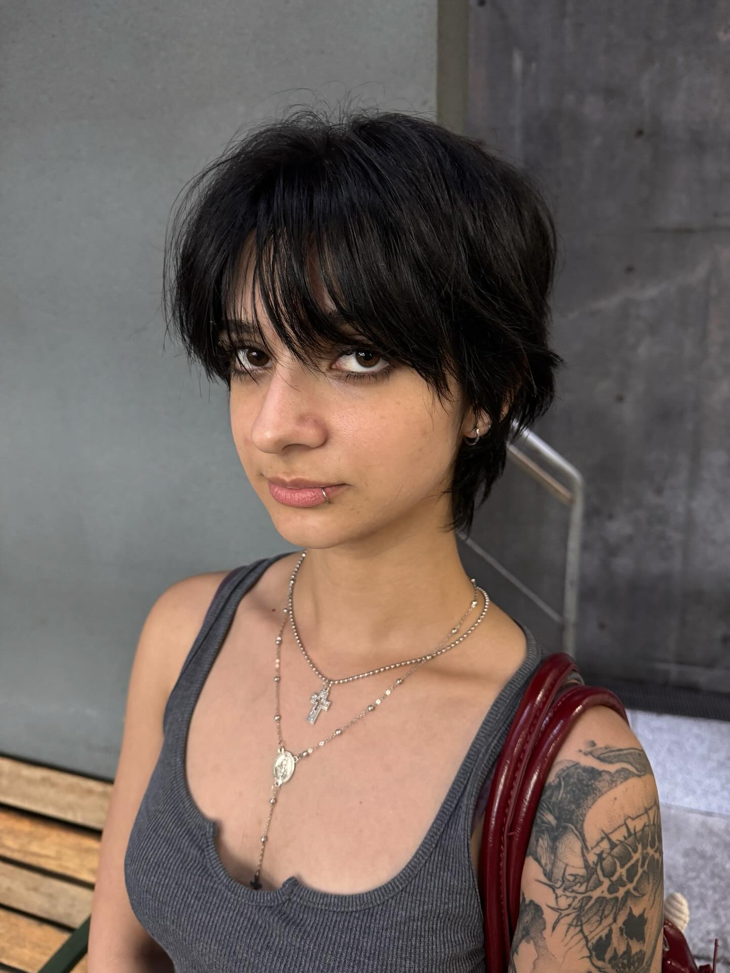 Sleek Jet-Black Wolfcut with Feathered Fringe