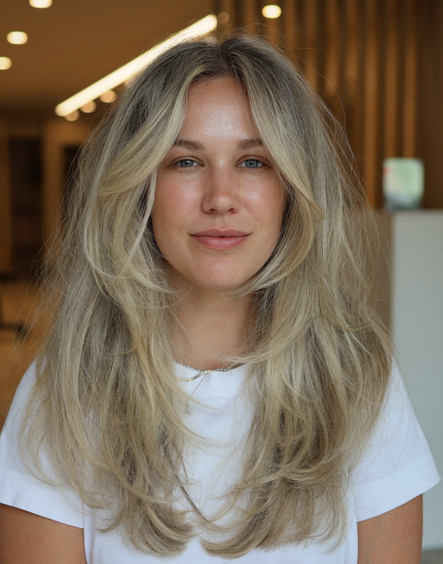 Soft Ash Blonde Waves with Delicate Face Framing