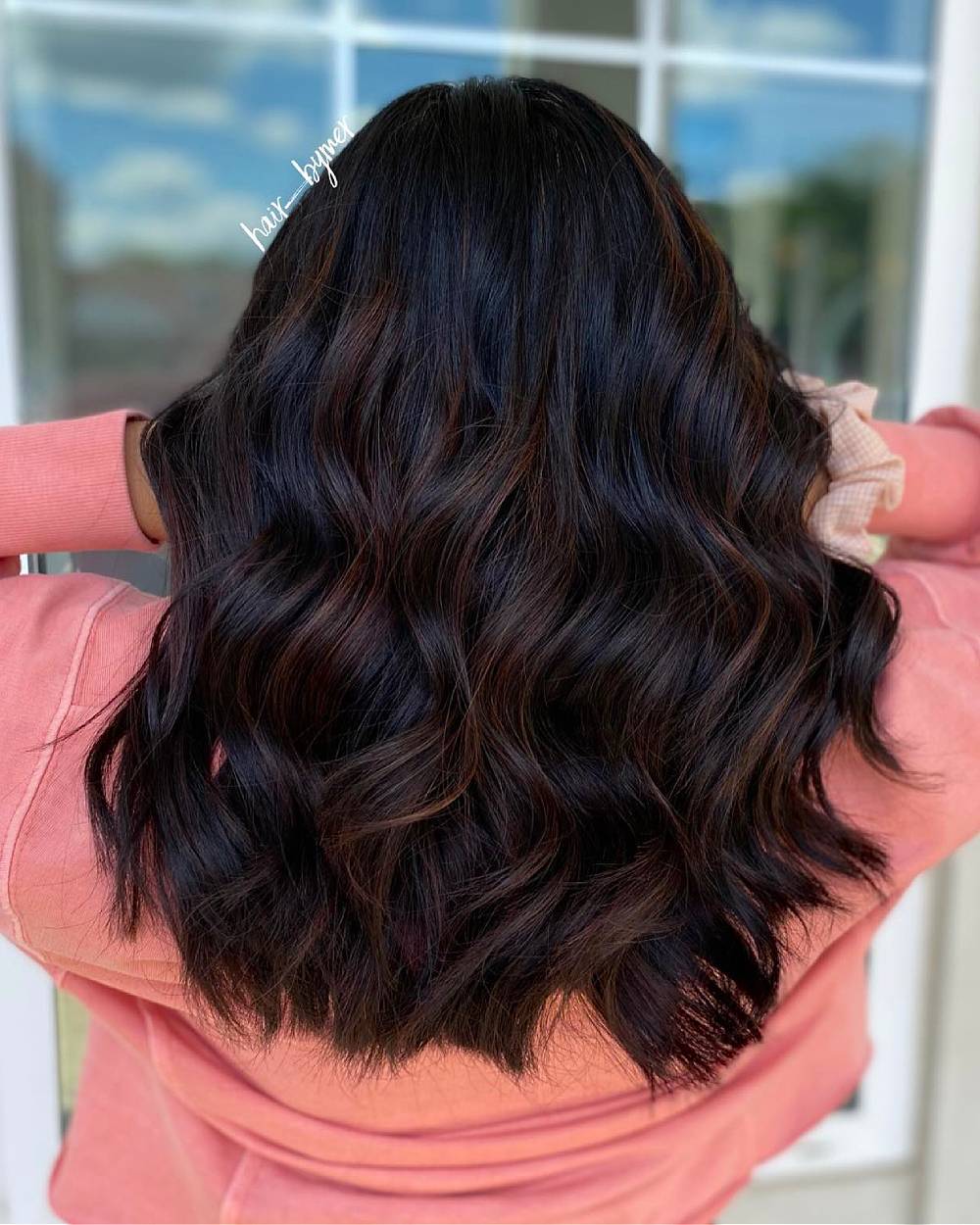 Softly Layered Black Hair with Subtle Auburn Balayage