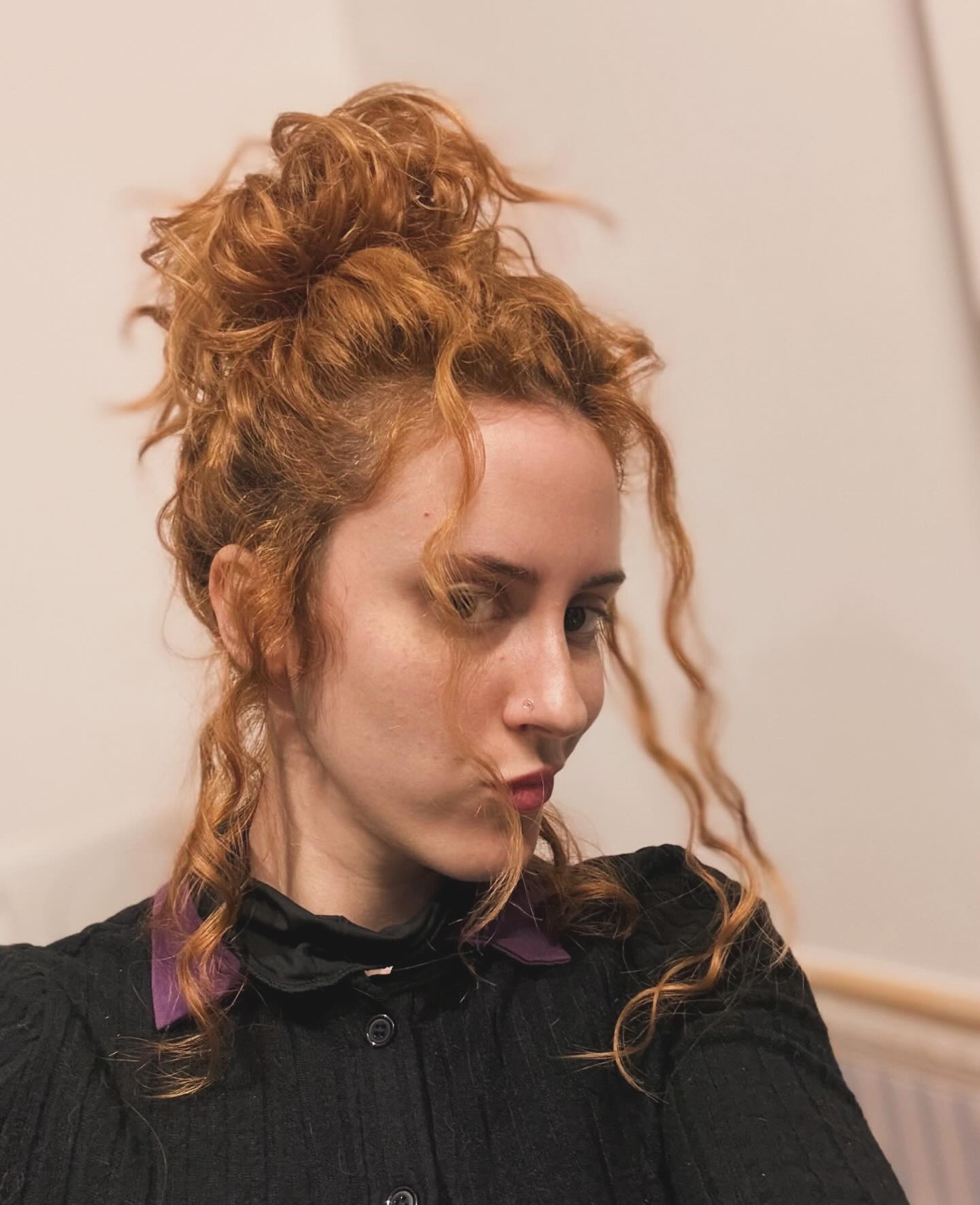 Creative Copper Top Knot with Playful Tendrils