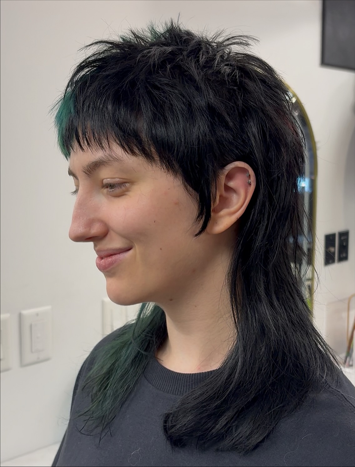 Dynamic Black Mullet with Teal Highlights