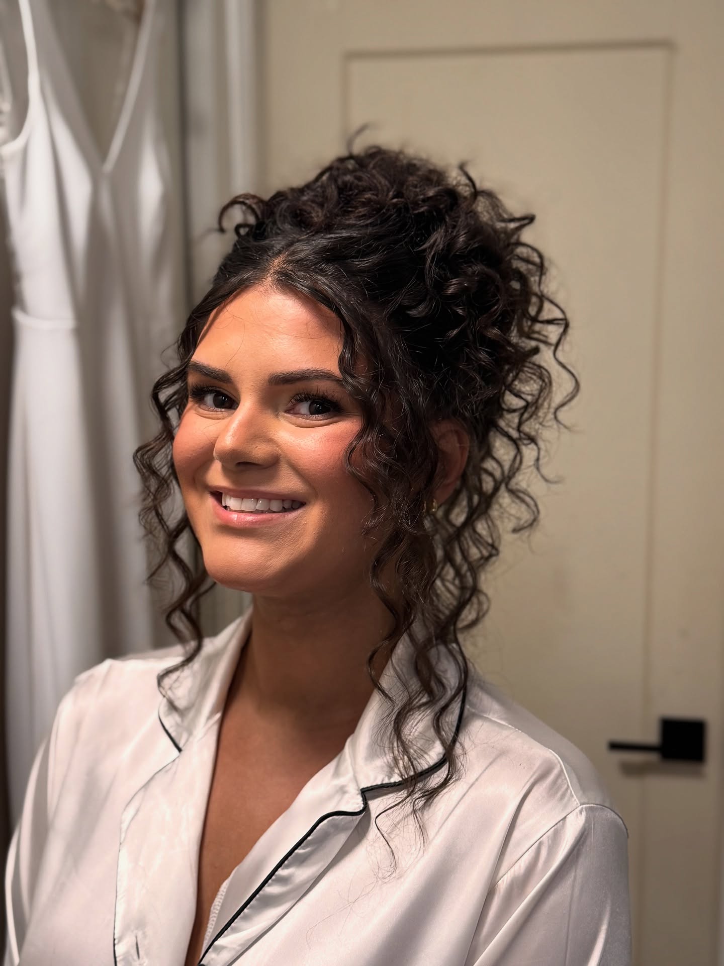 Elegant Curly Updo with Soft Highlights