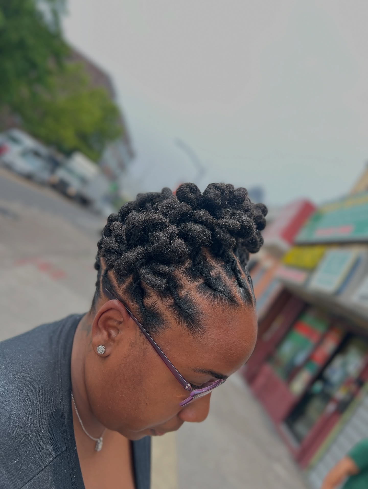 Sculpted Urban Dreadlock Bun with Intricate Side Parts