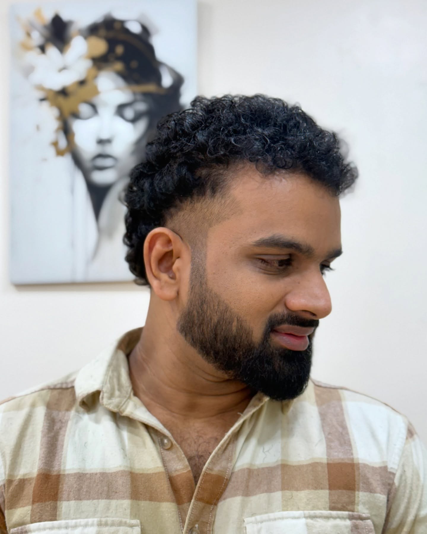 Artfully Sculpted Short Curly Top with Clean Edges