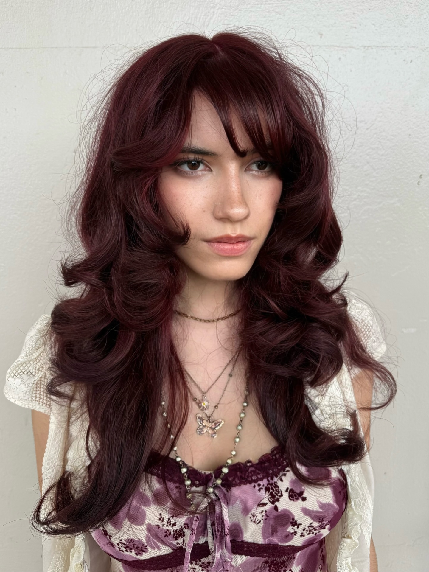 Burgundy Waves with Side-Swept Bangs