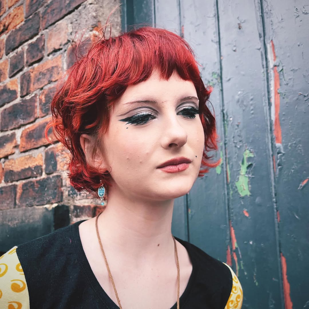 Chic Curly Bob with Bold Red Color