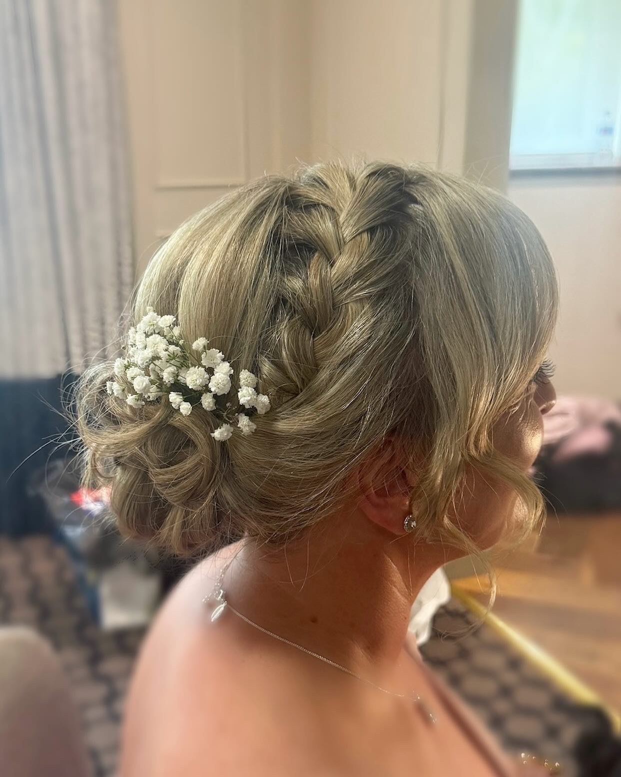 Classic Braided Updo with Floral Accent