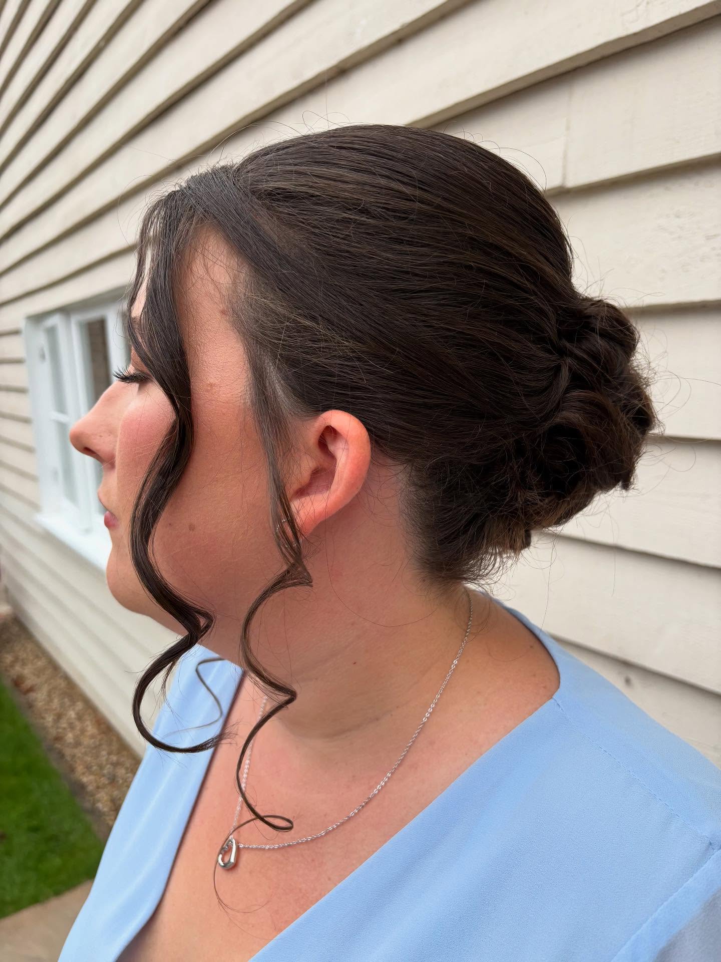 Classic Dark Low Bun with Loose Spiral Lock