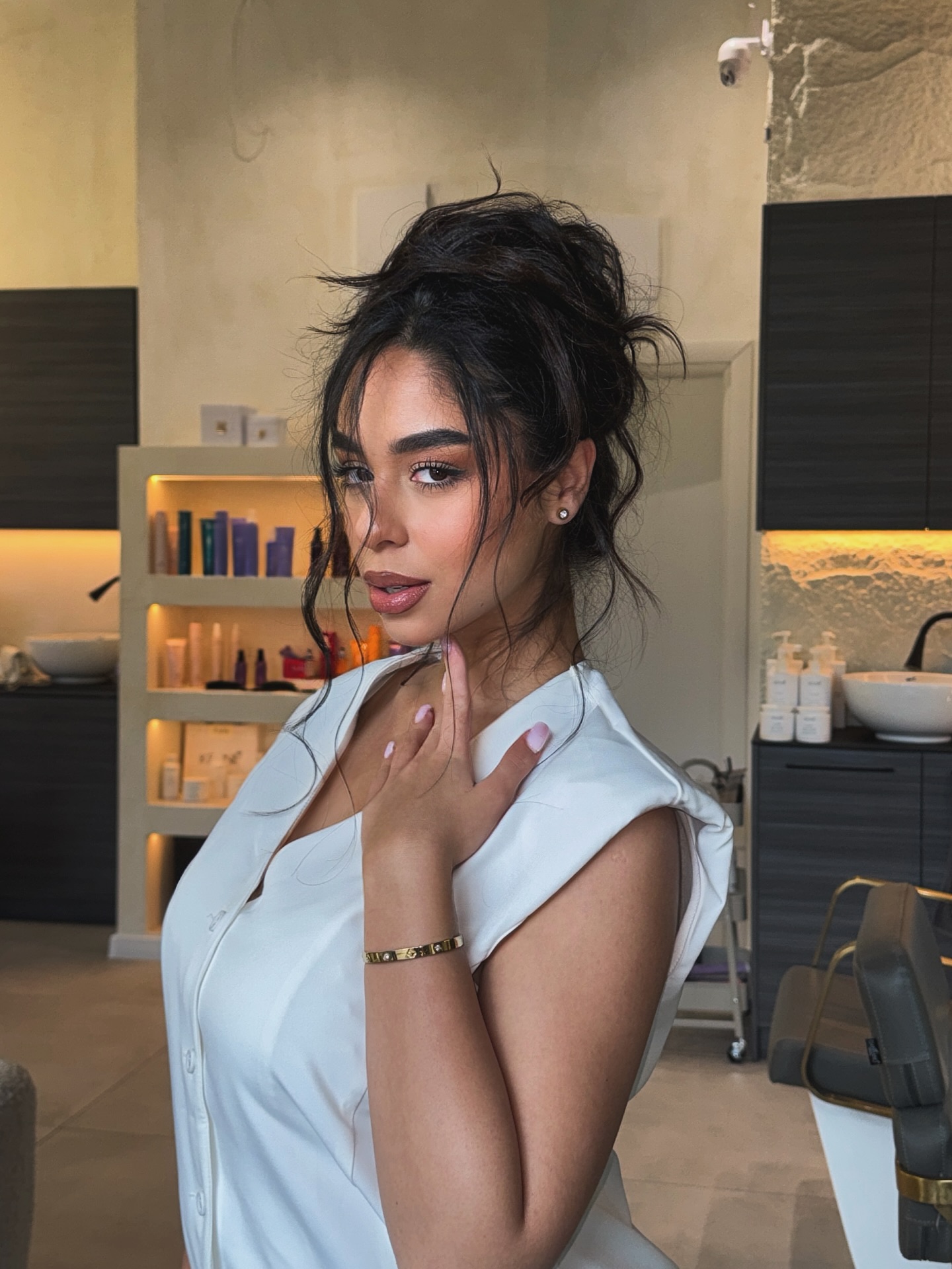 Effortless High Bun with Loose Strands