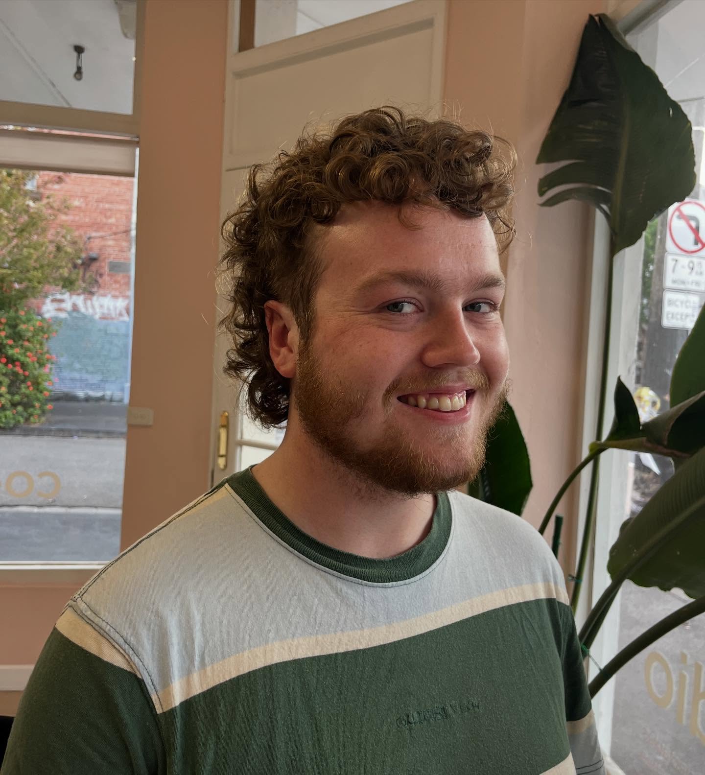 Effortlessly Casual Curly Top with Natural Side Taper