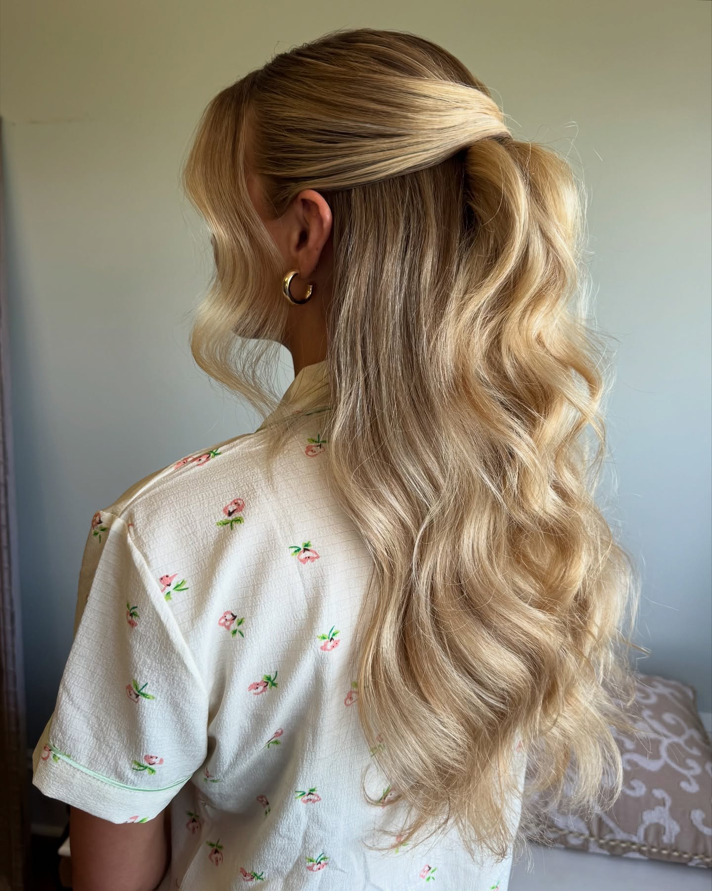 Elegant Cascading Blonde Waves with Twisted Half-Up Style