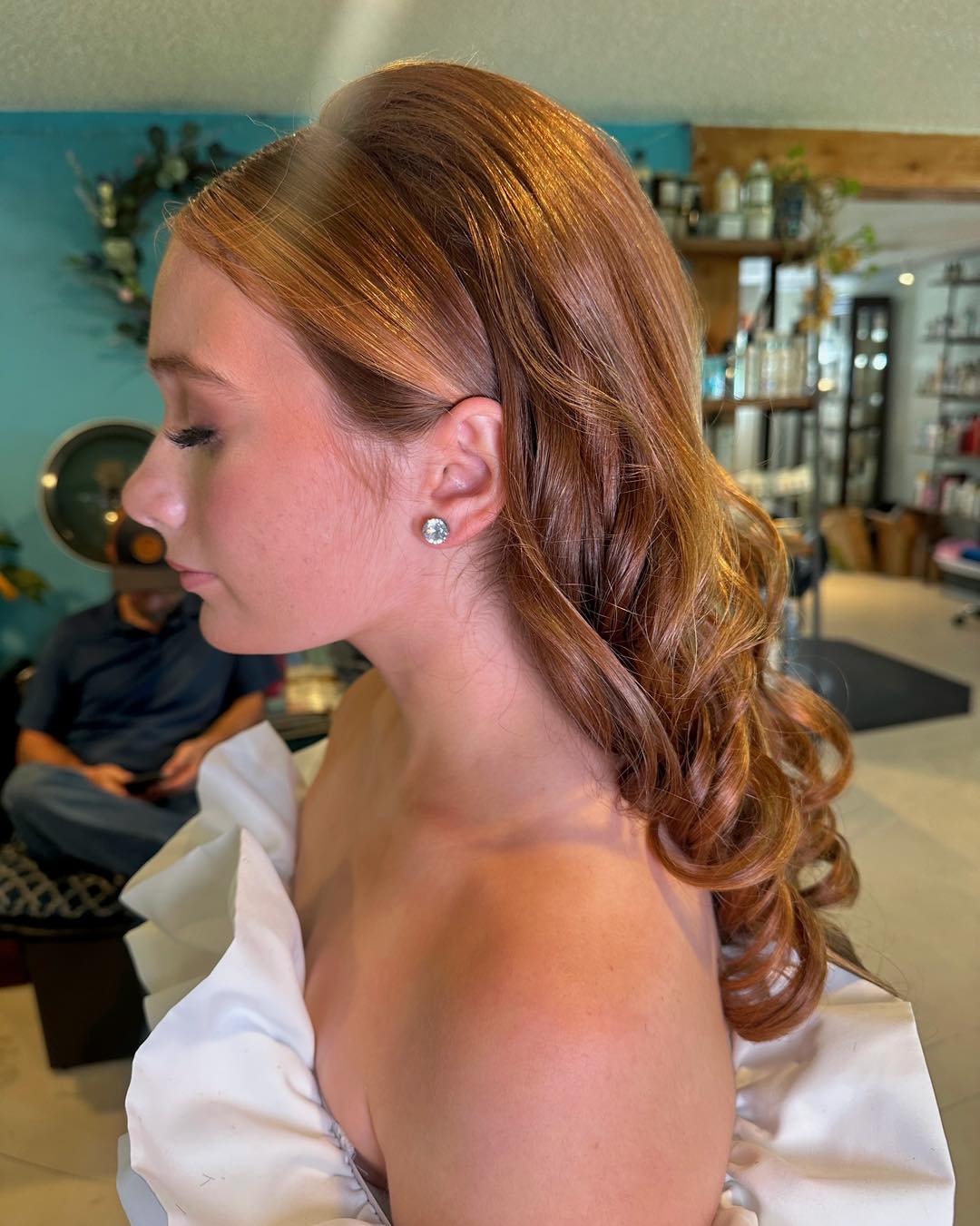Elegant Curled Half-Up Style with Glossy Finish