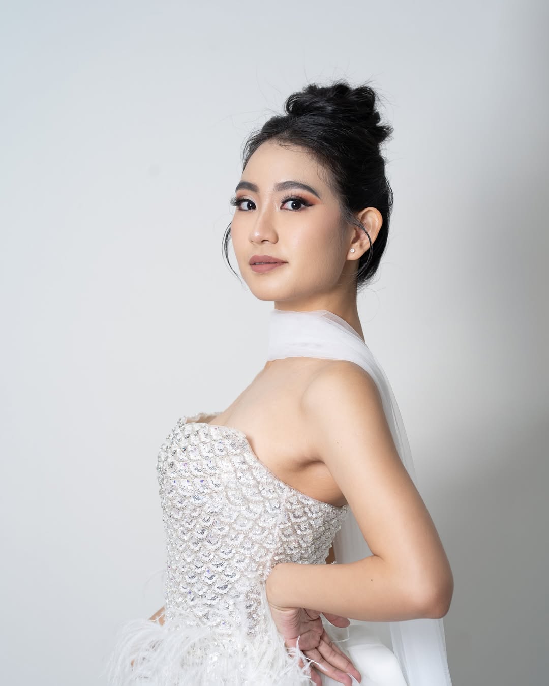 Elegant Textured Updo with Soft Tendrils