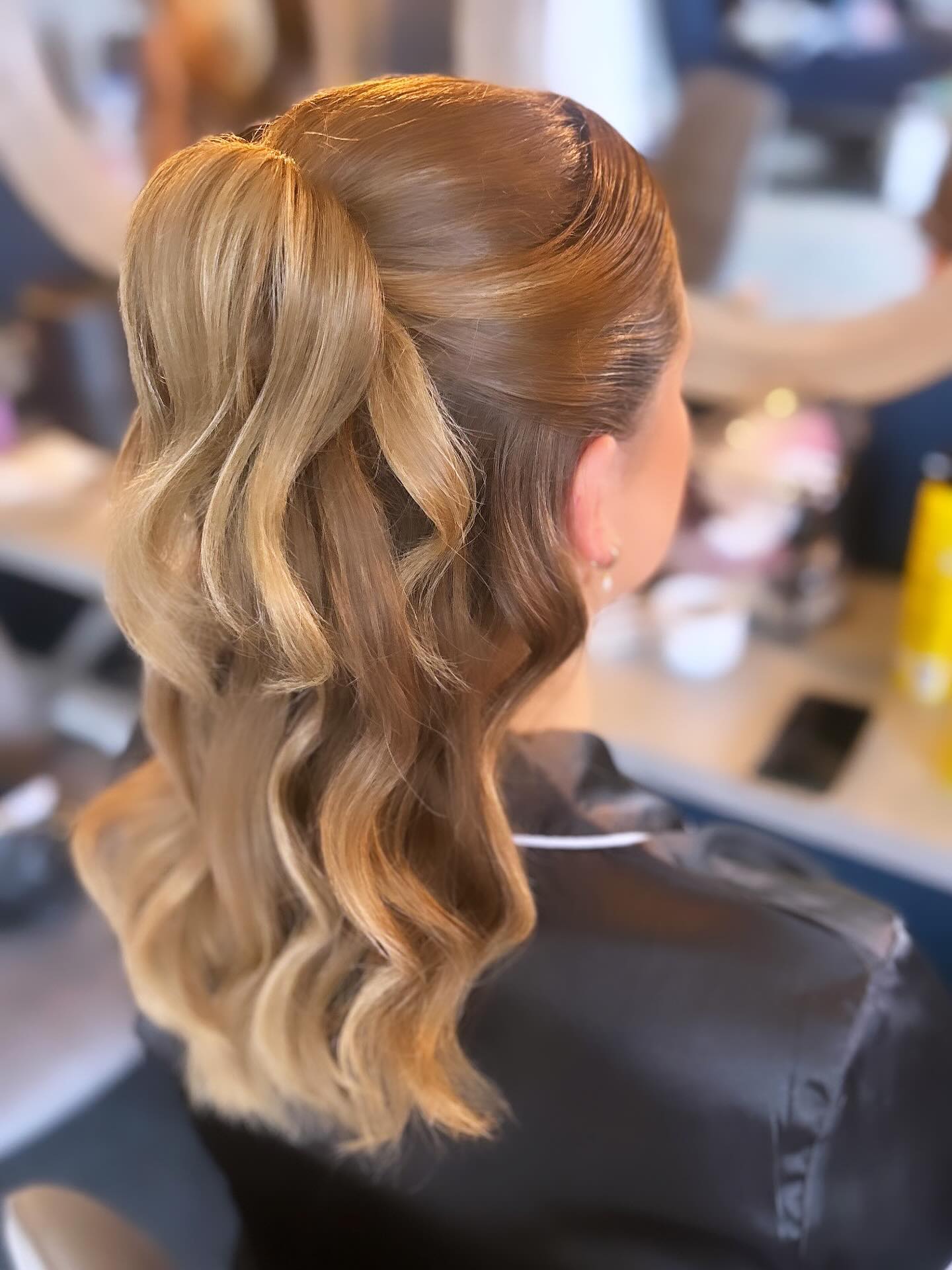 Polished Golden Half-Up Twist with Soft Waves