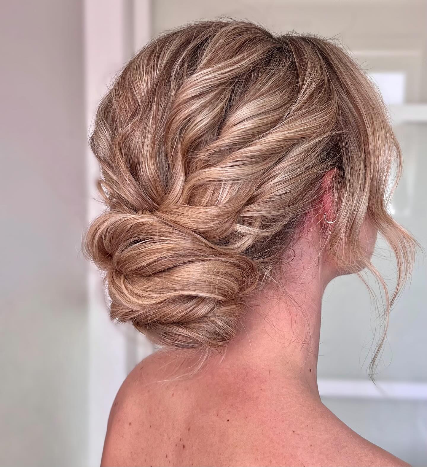Twisted Blonde Updo with Elegant Textured Strands