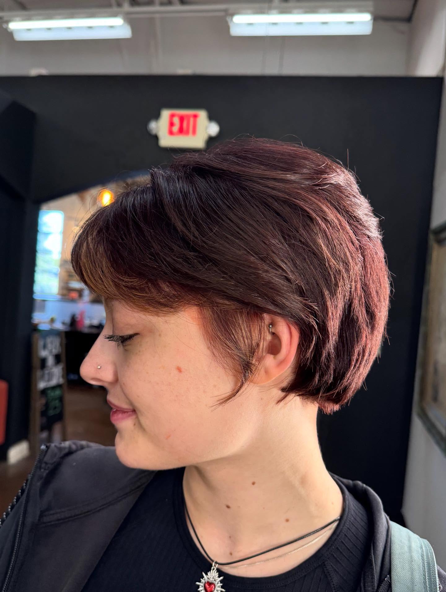 Chic Textured Pixie Cut with Rich Auburn Highlights