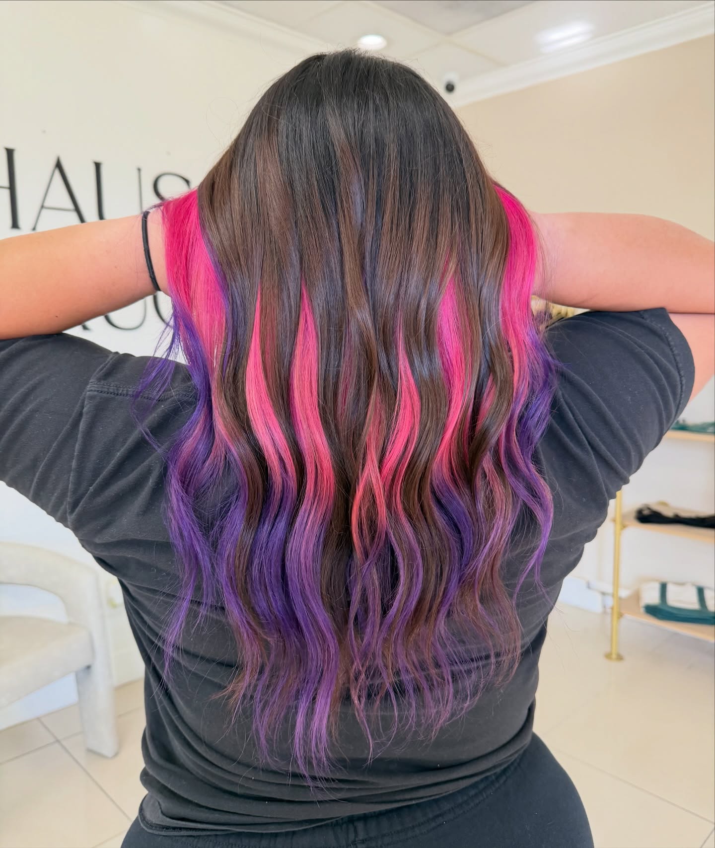 Long Cascading Curls with Hidden Pink and Purple Highlights